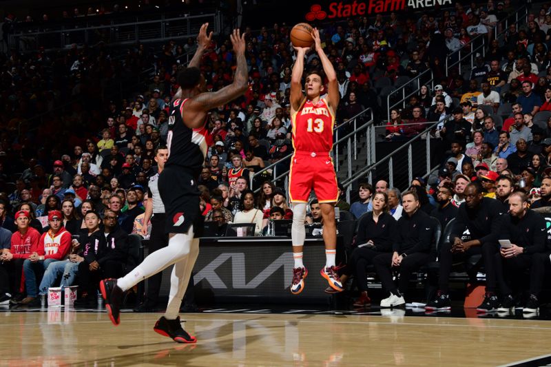 ATLANTA, GA - MARCH 3: Bogdan Bogdanovic #13 of the Atlanta Hawks shoots the ball during the game against the Portland Trail Blazers on March 3, 2023 at State Farm Arena in Atlanta, Georgia.  NOTE TO USER: User expressly acknowledges and agrees that, by downloading and/or using this Photograph, user is consenting to the terms and conditions of the Getty Images License Agreement. Mandatory Copyright Notice: Copyright 2023 NBAE (Photo by Scott Cunningham/NBAE via Getty Images)