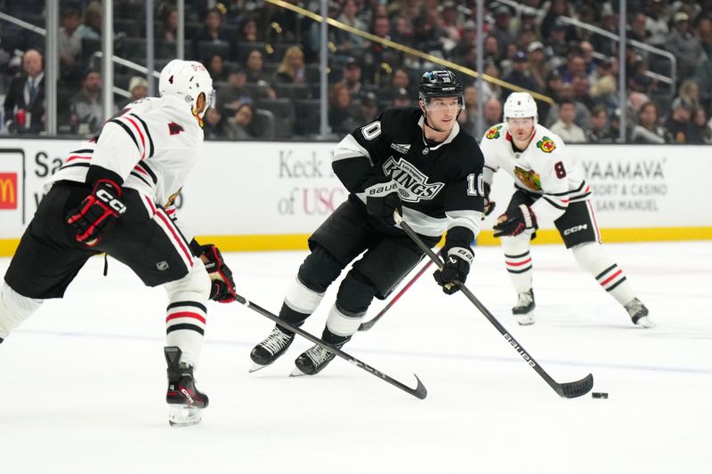 Nov 2, 2024; Los Angeles, California, USA; LA Kings left wing Tanner Jeannot (10) skates with the puck against the Chicago Blackhawks in the second period at Crypto.com Arena. Mandatory Credit: Kirby Lee-Imagn Images