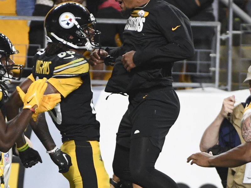 Pittsburgh Steelers wide receiver Tyler Vaughns (80) leaps in celebration with safety Minkah Fitzpatrick after making a touchdown catch against the Seattle Seahawks during the second half of an NFL preseason football game Saturday, Aug. 13, 2022, in Pittsburgh. The Steelers won 32-25.(AP Photo/Barry Reeger)