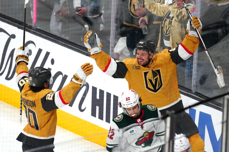 Apr 12, 2024; Las Vegas, Nevada, USA; Vegas Golden Knights center Tomas Hertl (48) celebrates with Vegas Golden Knights center Chandler Stephenson (20) after scoring a goal against the Minnesota Wild during the third period at T-Mobile Arena. Mandatory Credit: Stephen R. Sylvanie-USA TODAY Sports