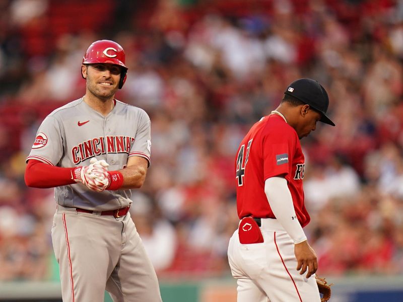 Jun 1, 2023; Boston, Massachusetts, USA; Cincinnati Reds catcher Curt Casali (12) hits a double against the Boston Red Sox in the third inning at Fenway Park. Mandatory Credit: David Butler II-USA TODAY Sports