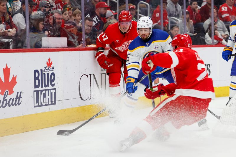 Mar 16, 2024; Detroit, Michigan, USA;  Buffalo Sabres defenseman Connor Clifton (75) skates with the puck chased by Detroit Red Wings right wing Daniel Sprong (17) in the second period at Little Caesars Arena. Mandatory Credit: Rick Osentoski-USA TODAY Sports