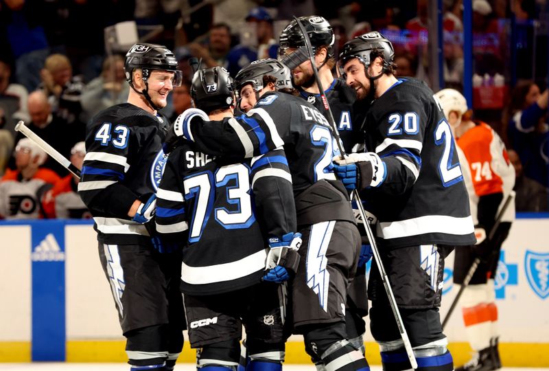 Mar 9, 2024; Tampa, Florida, USA; Tampa Bay Lightning left wing Conor Sheary (73) celebrates with teammates after scoring a goal against the Philadelphia Flyers during the first period at Amalie Arena. Mandatory Credit: Kim Klement Neitzel-USA TODAY Sports