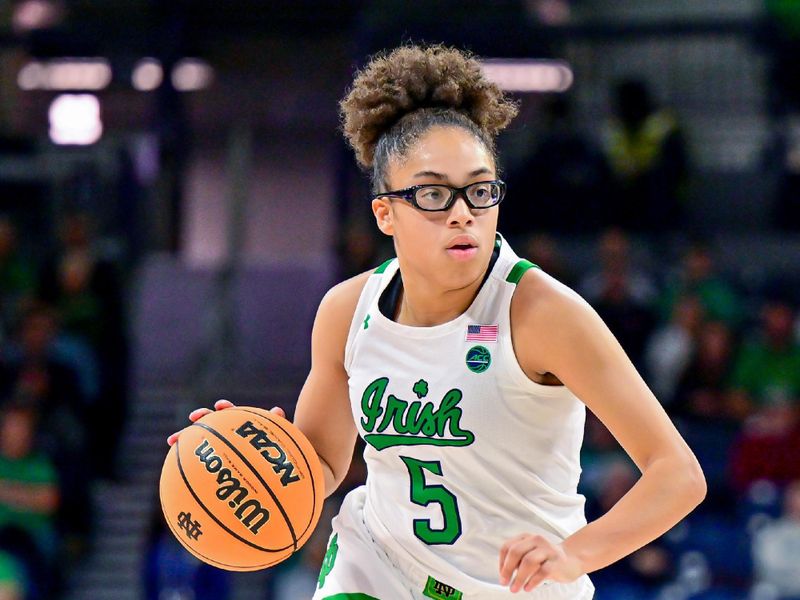 Jan 1, 2023; South Bend, Indiana, USA; Notre Dame Fighting Irish guard Olivia Miles (5) dribbles in the second half against the Boston College Eagles at the Purcell Pavilion. Mandatory Credit: Matt Cashore-USA TODAY Sports