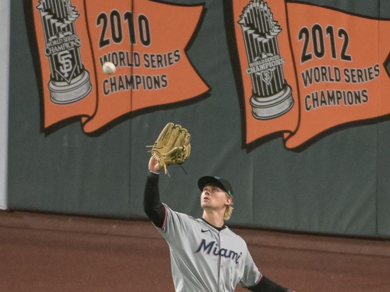 Jun 24, 2025; San Francisco, California, USA;  Miami Marlins outfielder Dane Myers (54) catches a fly ball in center field against the San Francisco Giants at Oracle Park. Mandatory Credit: Ed Szczepanski-Imagn Images