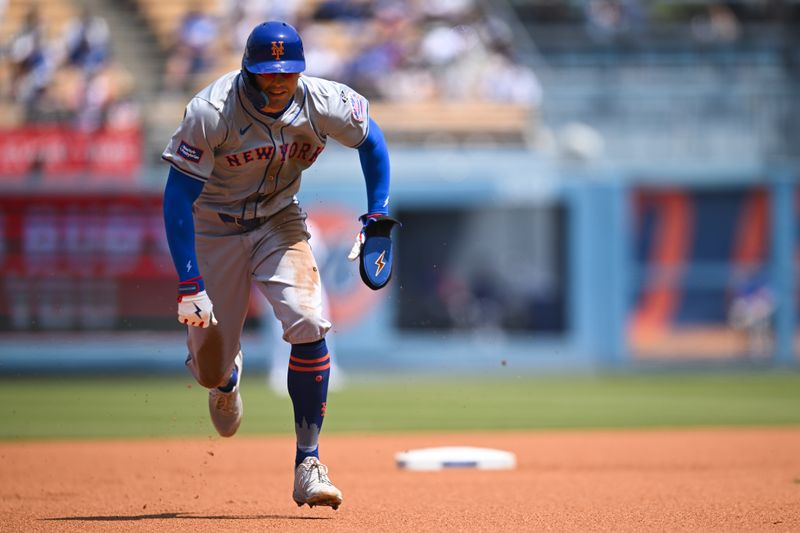 Apr 20, 2024; Los Angeles, California, USA; New York Mets outfielder Brandon Nimmo (9) steals second base against the Los Angeles Dodgers during the first inning at Dodger Stadium. Mandatory Credit: Jonathan Hui-USA TODAY Sports