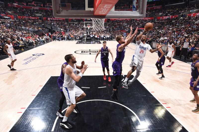 LOS ANGELES, CA - FEBRUARY 25: Norman Powell #24 of the LA Clippers shoots the ball during the game against the Sacramento Kings on February 25, 2024 at Crypto.Com Arena in Los Angeles, California. NOTE TO USER: User expressly acknowledges and agrees that, by downloading and/or using this Photograph, user is consenting to the terms and conditions of the Getty Images License Agreement. Mandatory Copyright Notice: Copyright 2024 NBAE (Photo by Adam Pantozzi/NBAE via Getty Images)