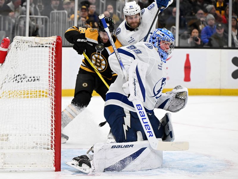 Jan 14, 2025; Boston, Massachusetts, USA; A shot made by Boston Bruins defenseman Parker Wotherspoon (not seen) goes past Tampa Bay Lightning goaltender Andrei Vasilevskiy (88) during the first period at the TD Garden. Mandatory Credit: Brian Fluharty-Imagn Images