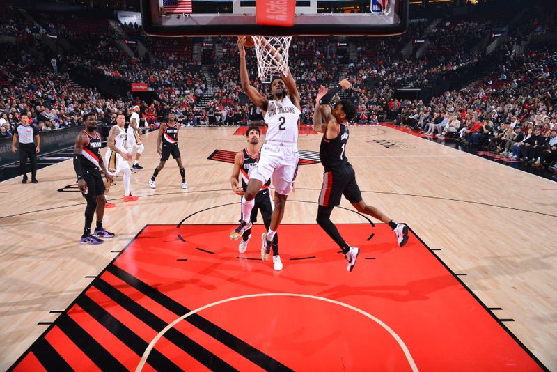 PORTLAND, OR - OCTOBER 25: Herbert Jones #2 of the New Orleans Pelicans drives to the basket during the game against the Portland Trail Blazers on October 25, 2024 at the Moda Center Arena in Portland, Oregon. NOTE TO USER: User expressly acknowledges and agrees that, by downloading and or using this photograph, user is consenting to the terms and conditions of the Getty Images License Agreement. Mandatory Copyright Notice: Copyright 2024 NBAE (Photo by Barry Gossage/NBAE via Getty Images)