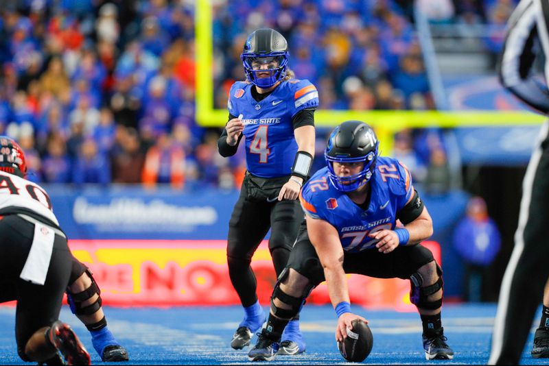 Nov 1, 2024; Boise, Idaho, USA; Boise State Broncos quarterback Maddux Madsen (4) during the first quarter against the San Diego State Aztecs at Albertsons Stadium. Mandatory Credit: Brian Losness-Imagn Images


