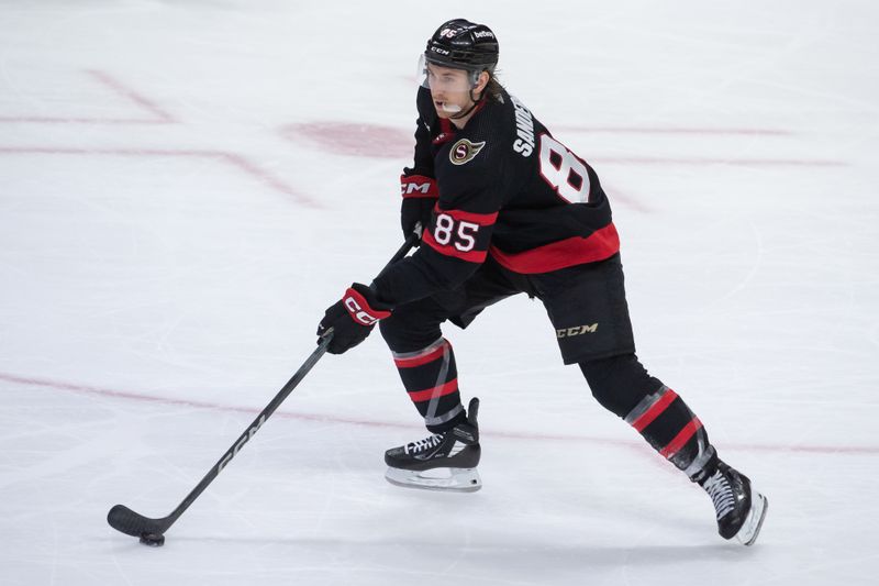 Jan 25, 2024; Ottawa, Ontario, CAN; Ottawa Senators defenseman Jake Sanderson (85) skates with the puck in the third period against the Boston Bruins at the Canadian Tire Centre. Mandatory Credit: Marc DesRosiers-USA TODAY Sports