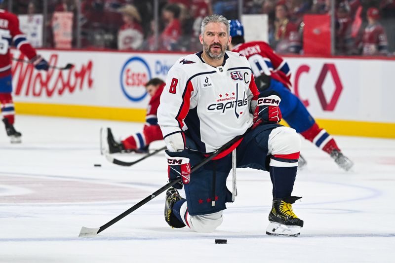 Apr 27, 2025; Montreal, Quebec, CAN; Washington Capitals left wing Alex Ovechkin (8) kneels on the ice watching his teammates during warm-ups before a game against the Montreal Canadiens in game four of the first round of the 2025 Stanley Cup Playoffs at Bell Centre. Mandatory Credit: David Kirouac-Imagn Images