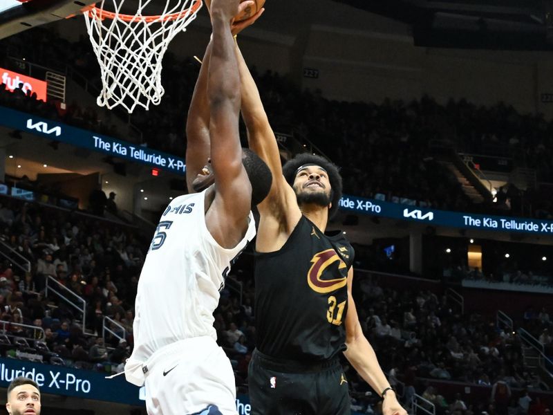 CLEVELAND, OHIO - APRIL 10: Jarrett Allen #31 of the Cleveland Cavaliers blocks a shot by Trey Jemison #55 of the Memphis Grizzlies during the second half at Rocket Mortgage Fieldhouse on April 10, 2024 in Cleveland, Ohio. NOTE TO USER: User expressly acknowledges and agrees that, by downloading and or using this photograph, User is consenting to the terms and conditions of the Getty Images License Agreement. (Photo by Nick Cammett/Getty Images)