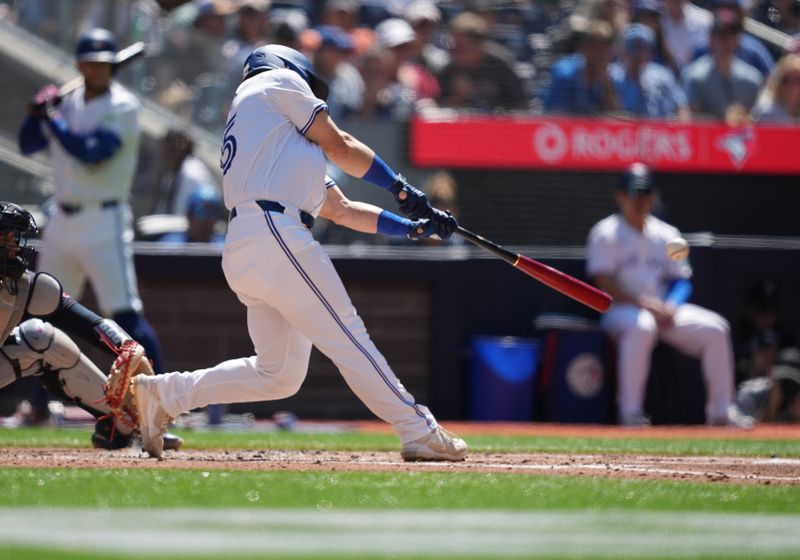 Jun 15, 2024; Toronto, Ontario, CAN; Toronto Blue Jays left fielder Daulton Varsho (25) hits a double against the Cleveland Guardians during the second inning at Rogers Centre. Mandatory Credit: Nick Turchiaro-USA TODAY Sports