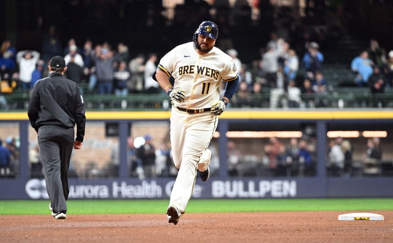 Apr 25, 2023; Milwaukee, Wisconsin, USA; Milwaukee Brewers first baseman Rowdy Tellez (11) rounds the bases after hitting a solo home run against the Detroit Tigers in the sixth inning at American Family Field. Mandatory Credit: Michael McLoone-USA TODAY Sports