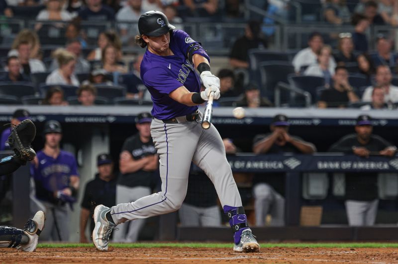 Aug 23, 2024; Bronx, New York, USA; Colorado Rockies first baseman Michael Toglia (4) singles during the fourth inning against the New York Yankees at Yankee Stadium. Mandatory Credit: Vincent Carchietta-USA TODAY Sports