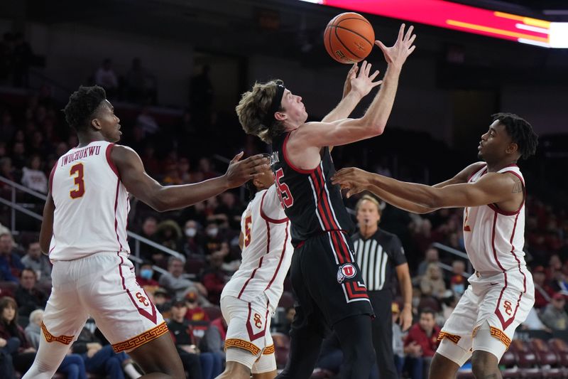 Jan 14, 2023; Los Angeles, California, USA; Utah Utes guard Gabe Madsen (55) battles for the ball with Southern California Trojans forward VIncent Iwuchukwu (3), guard Boogie Ellis (5) and guard Reese Dixon-Waters (2) in the first half at Galen Center. Mandatory Credit: Kirby Lee-USA TODAY Sports