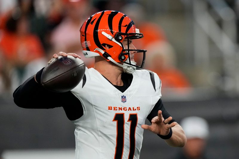Cincinnati Bengals quarterback Logan Woodside (11) throws a pass during the first half of a preseason NFL football game against the Indianapolis Colts, Thursday, Aug. 22, 2024, in Cincinnati. (AP Photo/Carolyn Kaster)