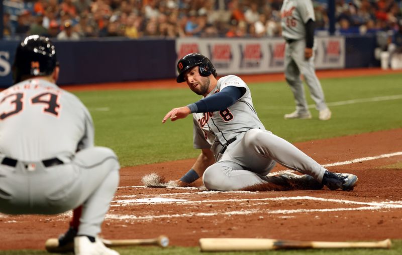 Apr 22, 2024; St. Petersburg, Florida, USA; Detroit Tigers outfielder Matt Vierling (8) sides safe into home during the second inning against the Tampa Bay Rays at Tropicana Field. Mandatory Credit: Kim Klement Neitzel-USA TODAY Sports