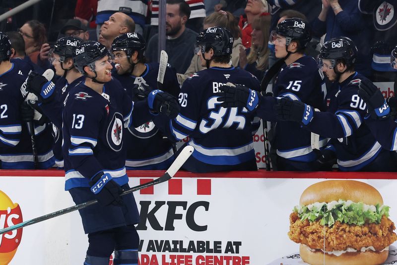 Dec 14, 2024; Winnipeg, Manitoba, CAN; Winnipeg Jets center Gabriel Vilardi (13) celebrates his first period goal against the Montreal Canadiens at Canada Life Centre. Mandatory Credit: James Carey Lauder-Imagn Images