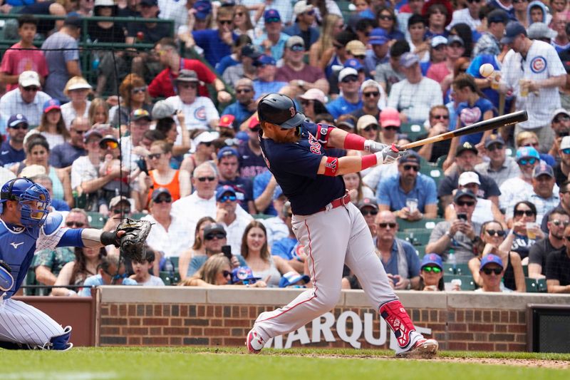 Jul 16, 2023; Chicago, Illinois, USA; Boston Red Sox first baseman Justin Turner (2) hits a single against the Chicago Cubs during the fifth inning at Wrigley Field. Mandatory Credit: David Banks-USA TODAY Sports