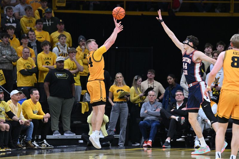 Jan 11, 2026; Iowa City, Iowa, USA; Iowa Hawkeyes guard Bennett Stirtz (14) shoots the ball as Illinois Fighting Illini center Zvonimir Ivisic (44) defends during the first half at Carver-Hawkeye Arena. Mandatory Credit: Jeffrey Becker-Imagn Images