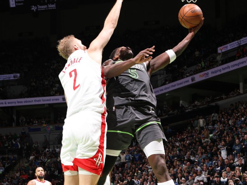 MINNEAPOLIS, MN -  NOVEMBER 26: Anthony Edwards #5 of the Minnesota Timberwolves drives to the basket during the game against the Houston Rockets during the Emirates NBA Cup game on November 26, 2024 at Target Center in Minneapolis, Minnesota. NOTE TO USER: User expressly acknowledges and agrees that, by downloading and or using this Photograph, user is consenting to the terms and conditions of the Getty Images License Agreement. Mandatory Copyright Notice: Copyright 2024 NBAE (Photo by David Sherman/NBAE via Getty Images)