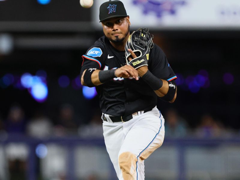 Apr 26, 2024; Miami, Florida, USA; Miami Marlins second baseman Luis Arraez (3) throws to first base to retire Washington Nationals second baseman Luis Garcia Jr. (not pcitured) during the fourth inning at loanDepot Park. Mandatory Credit: Sam Navarro-USA TODAY Sports