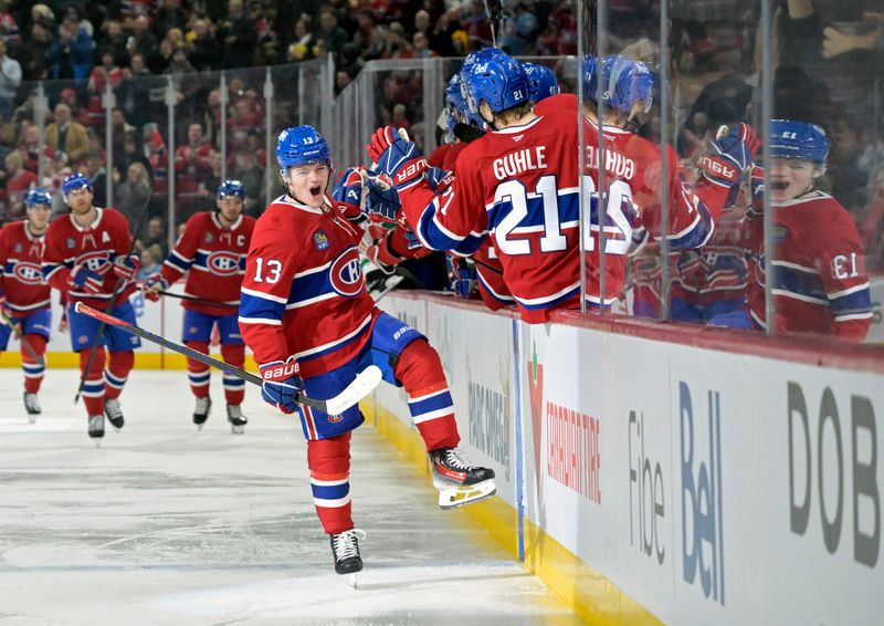 Jan 6, 2025; Montreal, Quebec, CAN; Montreal Canadiens forward Cole Caufield (13) celebrates with teammates after scoring a goal against the Vancouver Canucks during the first period at the Bell Centre. Mandatory Credit: Eric Bolte-Imagn Images