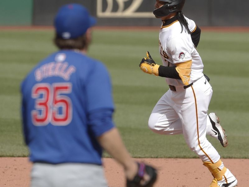 May 11, 2024; Pittsburgh, Pennsylvania, USA;  Chicago Cubs pitcher Justin Steele (35) looks on as Pittsburgh Pirates first baseman Connor Joe (right) circles the bases on a three run home run during the third inning at PNC Park. Mandatory Credit: Charles LeClaire-USA TODAY Sports