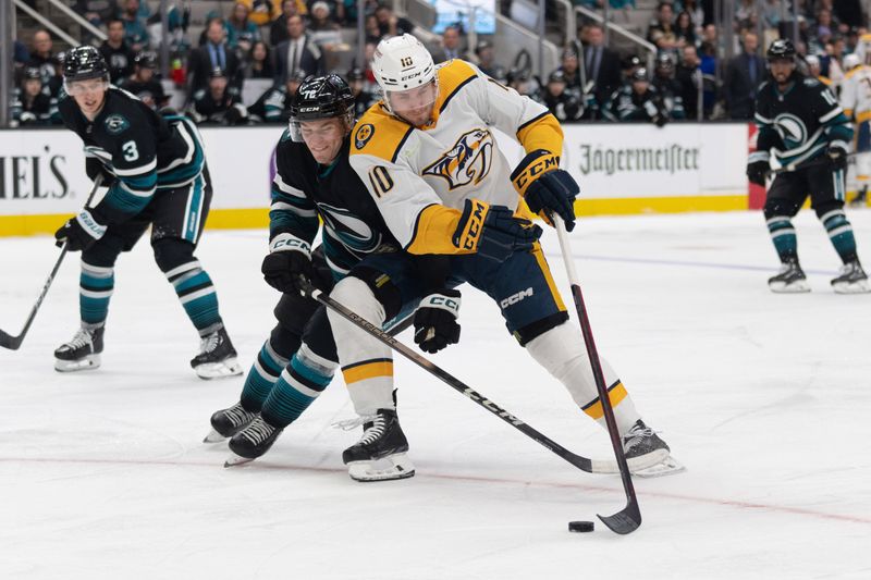 Feb 24, 2024; San Jose, California, USA; San Jose Sharks left wing William Eklund (72) and Nashville Predators center Colton Sissons (10) fight for control of the puck during the first period at SAP Center at San Jose. Mandatory Credit: Stan Szeto-USA TODAY Sports