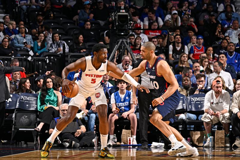 PHILADELPHIA, PA - APRIL 9: Chimezie Metu #5 of the Detroit Pistons dribbles the ball during the game against the Philadelphia 76ers on April 9, 2024 at the Wells Fargo Center in Philadelphia, Pennsylvania NOTE TO USER: User expressly acknowledges and agrees that, by downloading and/or using this Photograph, user is consenting to the terms and conditions of the Getty Images License Agreement. Mandatory Copyright Notice: Copyright 2024 NBAE (Photo by David Dow/NBAE via Getty Images)