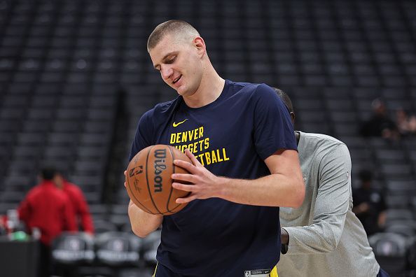 LOS ANGELES, CALIFORNIA - DECEMBER 06: Nikola Jokic #15 of the Denver Nuggets handles the ball as he warms up prior to a game against the LA Clippers at Crypto.com Arena on December 06, 2023 in Los Angeles, California. NOTE TO USER: User expressly acknowledges and agrees that, by downloading and/or using this Photograph, user is consenting to the terms and conditions of the Getty Images License Agreement. (Photo by Michael Owens/Getty Images)