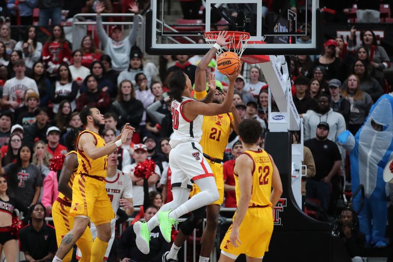 Jan 30, 2023; Lubbock, Texas, USA;  Texas Tech Red Raiders guard Jaylon Tyson (20) goes to the basket against Iowa State Cyclones center Osun Osunniyi (21) in the first half at United Supermarkets Arena. Mandatory Credit: Michael C. Johnson-USA TODAY Sports