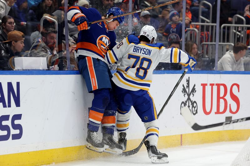 Nov 30, 2024; Elmont, New York, USA; Buffalo Sabres defenseman Jacob Bryson (78) checks New York Islanders left wing Matt Martin (17) during the second period at UBS Arena. Mandatory Credit: Brad Penner-Imagn Images