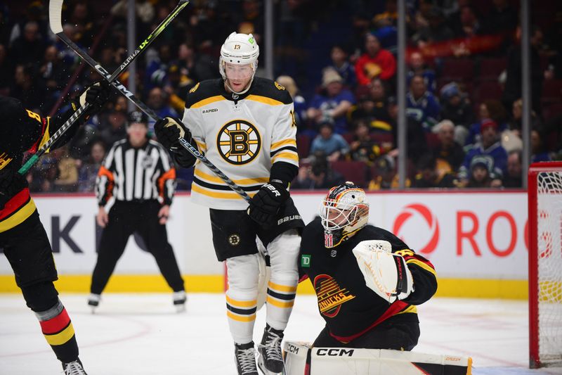 Feb 25, 2023; Vancouver, British Columbia, CAN; Vancouver Canucks goaltender Arturs Silovs (31) defends against Boston Bruins forward Charlie Coyle (13) during the second period at Rogers Arena. Mandatory Credit: Anne-Marie Sorvin-USA TODAY Sports