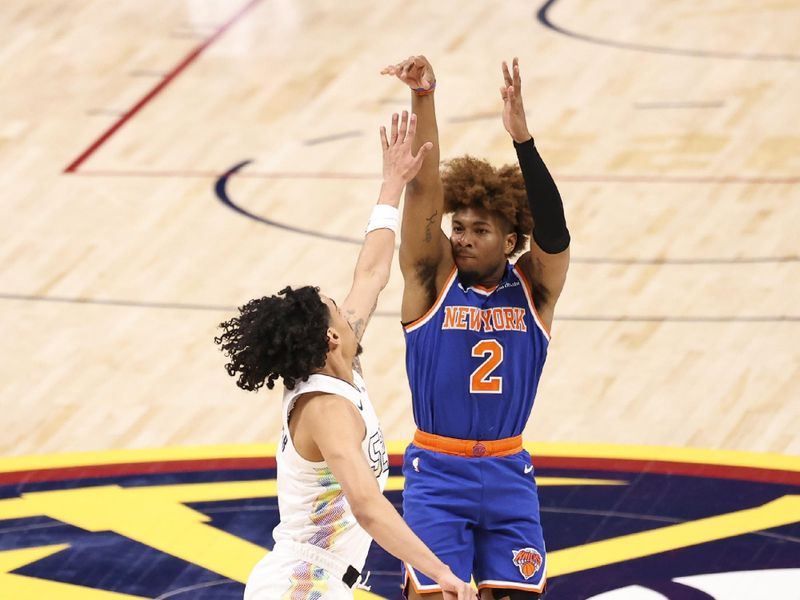 DENVER, COLORADO - NOVEMBER 25: Miles McBride #2 of the New York Knicks shoots the ball over Julian Strawther #3 of the Denver Nuggets during the second half at Ball Arena on November 25, 2024 in Denver, Colorado. NOTE TO USER: User expressly acknowledges and agrees that, by downloading and/or using this Photograph, user is consenting to the terms and conditions of the Getty Images License Agreement. (Photo by Justin Tafoya/Getty Images)