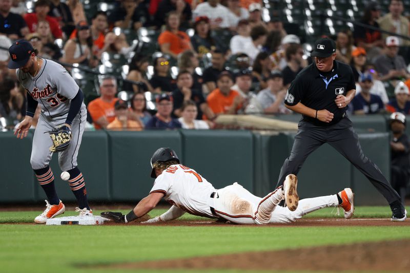 Jun 10, 2025; Baltimore, Maryland, USA; Baltimore Orioles second baseman Jackson Holliday (7) advances to third past Detroit Tigers outfielder Zach McKinstry (39) during the eighth inning at Oriole Park at Camden Yards. Mandatory Credit: Daniel Kucin Jr.-Imagn Images
