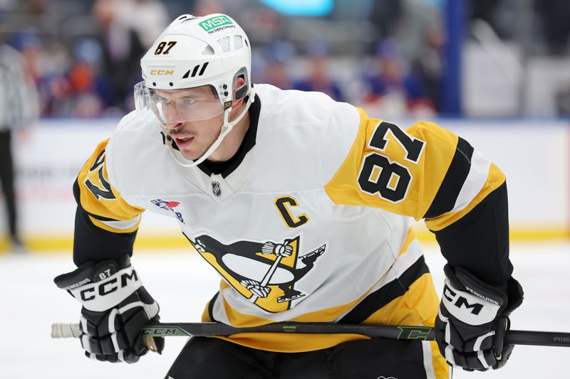 Nov 5, 2024; Elmont, New York, USA; Pittsburgh Penguins center Sidney Crosby (87) skates against the New York Islanders during the first period at UBS Arena. Mandatory Credit: Brad Penner-Imagn Images