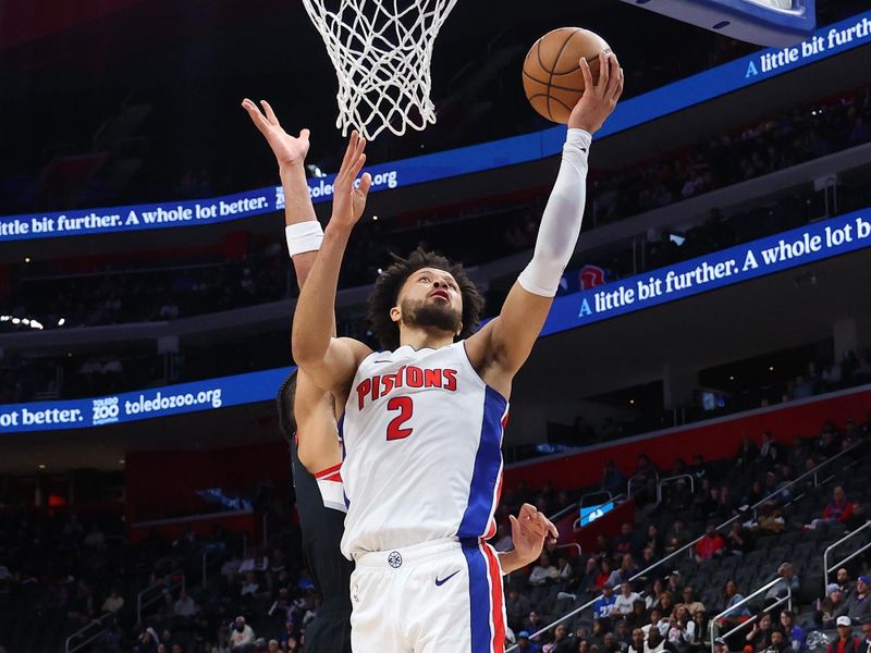 DETROIT, MICHIGAN - JANUARY 06: Cade Cunningham #2 of the Detroit Pistons drives to the basket against Toumani Camara #33 of the Portland Trail Blazers during the first half at Little Caesars Arena on January 06, 2025 in Detroit, Michigan. Detroit won the game 118-115. NOTE TO USER: User expressly acknowledges and agrees that, by downloading and or using this photograph, User is consenting to the terms and conditions of the Getty Images License. (Photo by Gregory Shamus/Getty Images)