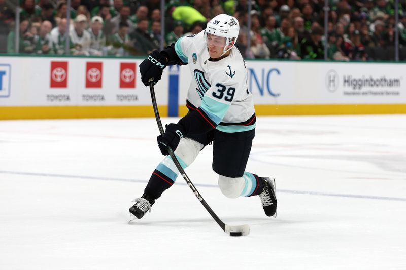 Apr 13, 2024; Dallas, Texas, USA; Seattle Kraken defenseman Ryker Evans (39) shoots the puck against the Dallas Stars in the first period at American Airlines Center. Mandatory Credit: Tim Heitman-USA TODAY Sports