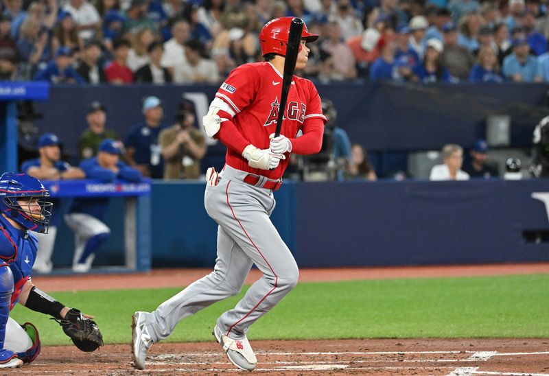 Jul 29, 2023; Toronto, Ontario, CAN; Los Angeles Angels designated hitter Shohei Ohtani (17) hits a double against the Toronto Blue Jays in the third inning at Rogers Centre. Mandatory Credit: Dan Hamilton-USA TODAY Sports