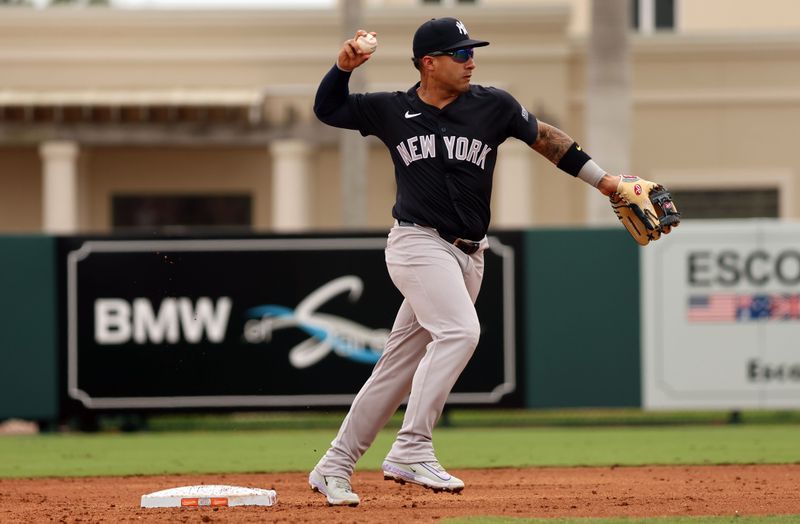 Mar 2, 2024; Sarasota, Florida, USA;  New York Yankees second baseman Gleyber Torres (25) forces out at second base and throws the ball to first base for a double play during the second inning against the Baltimore Orioles at Ed Smith Stadium. Mandatory Credit: Kim Klement Neitzel-USA TODAY Sports