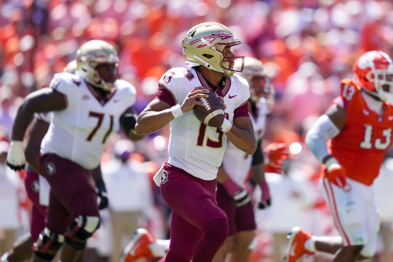 Sep 23, 2023; Clemson, South Carolina, USA; Florida State Seminoles quarterback Jordan Travis (13) looks to pass in the first half against the Clemson Tigers at Memorial Stadium. Mandatory Credit: David Yeazell-USA TODAY Sports