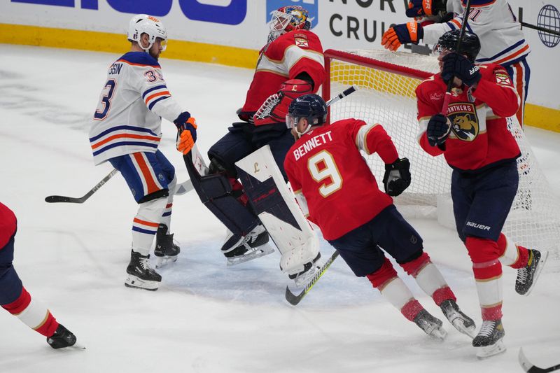 Jun 9, 2025; Sunrise, Florida, USA; Edmonton Oilers left wing Viktor Arvidsson (33) collides with Florida Panthers goaltender Sergei Bobrovsky (72) during the first period in game three of the 2025 Stanley Cup Final at Amerant Bank Arena. Mandatory Credit: Jim Rassol-Imagn Images