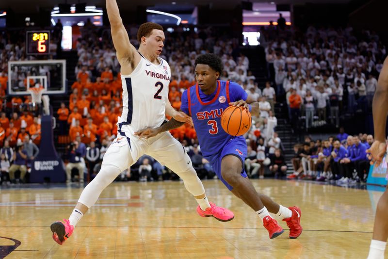 Jan 15, 2025; Charlottesville, Virginia, USA; Southern Methodist Mustangs guard Chuck Harris (3) dribbles the ball as Virginia Cavaliers forward Elijah Saunders (2) defends during the first half at John Paul Jones Arena. Mandatory Credit: Amber Searls-Imagn Images