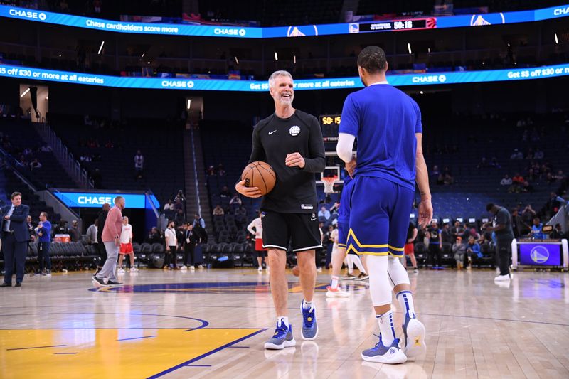 SAN FRANCISCO, CA - JANUARY 27: Assistant Coach Bruce Fraser of the Golden State Warriors warms up with Stephen Curry #30 before the game against the Toronto Raptors on January 27, 2023 at Chase Center in San Francisco, California. NOTE TO USER: User expressly acknowledges and agrees that, by downloading and or using this photograph, user is consenting to the terms and conditions of Getty Images License Agreement. Mandatory Copyright Notice: Copyright 2023 NBAE (Photo by Noah Graham/NBAE via Getty Images)