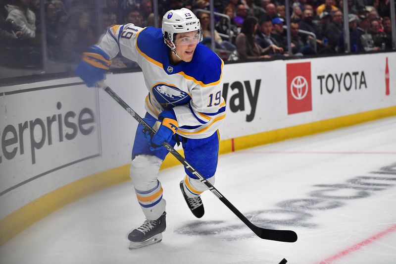 Feb 13, 2023; Los Angeles, California, USA; Buffalo Sabres center Peyton Krebs (19) moves the puck against the Los Angeles Kings during the first period at Crypto.com Arena. Mandatory Credit: Gary A. Vasquez-USA TODAY Sports