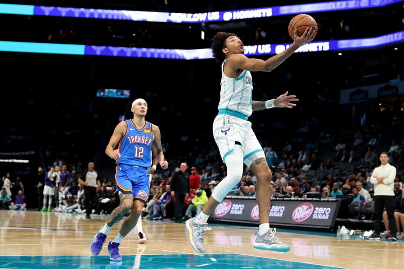 CHARLOTTE, NC - OCTOBER 15: Nick Smith Jr. #8 of the Charlotte Hornets drives to the basket during the game against the Oklahoma City Thunder on October 15, 2023 at Spectrum Center in Charlotte, North Carolina. NOTE TO USER: User expressly acknowledges and agrees that, by downloading and or using this photograph, User is consenting to the terms and conditions of the Getty Images License Agreement.  Mandatory Copyright Notice:  Copyright 2023 NBAE (Photo by Brock Williams-Smith/NBAE via Getty Images)