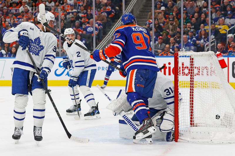 Jan 16, 2024; Edmonton, Alberta, CAN; Edmonton Oilers /97 watches a shot by forward Ryan McLeod (71) (not shown) get past Toronto Maple Leafs goaltender Martin Jones (31) during the third period at Rogers Place. Mandatory Credit: Perry Nelson-USA TODAY Sports